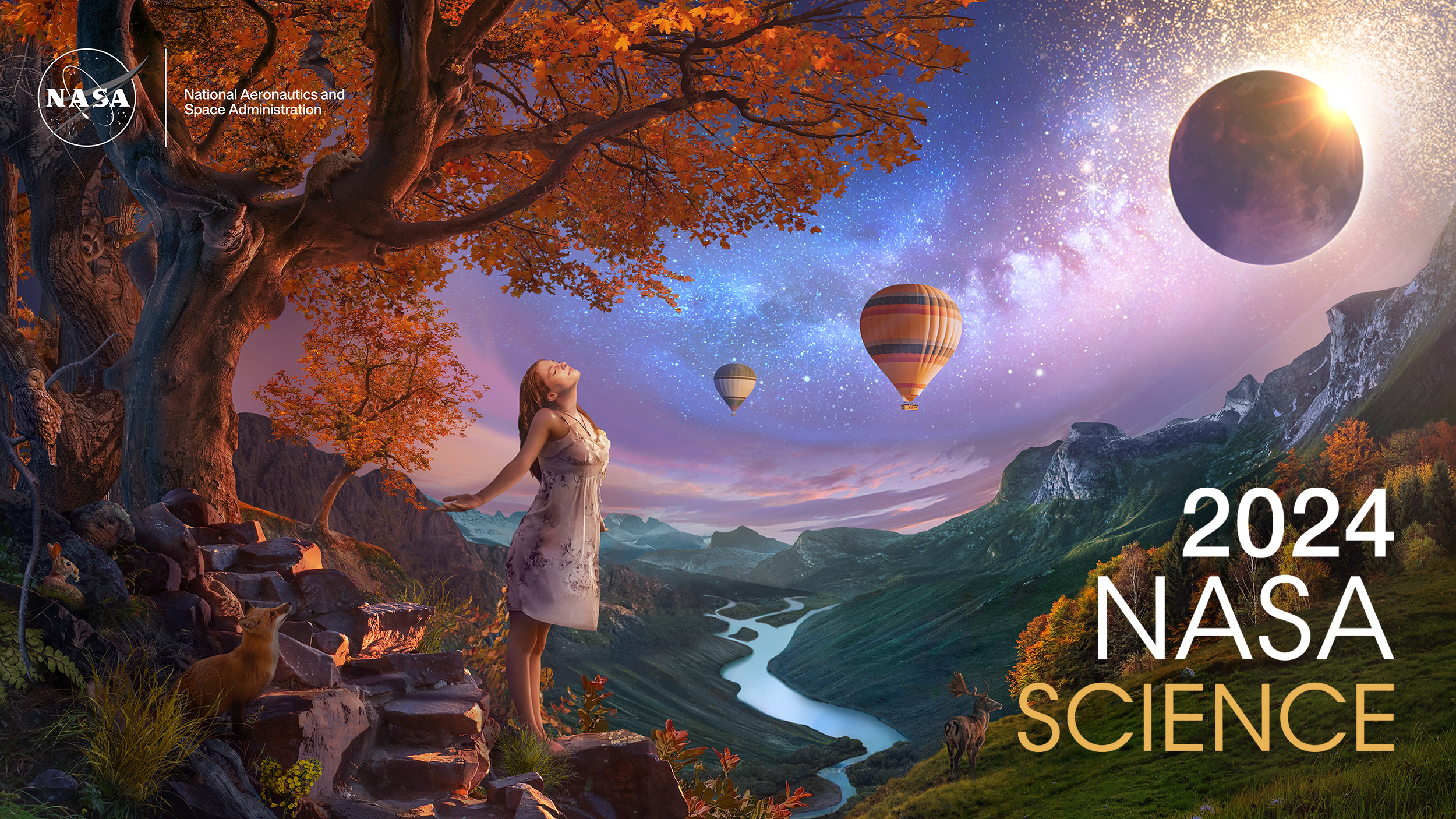An artist’s concept of a landscape, composed of dusky purples, oranges, golds, and greens. In the left foreground, a young woman wearing a white dress basks in the rays of a solar eclipse. She stands under a bright orange fall tree rooted to the side of a rocky mountain trail. The scene overlooks a valley with a river running through the middle towards distant hazy blue mountains. Nocturnal animals – including a fox, owl, possum, and bat – emerge to investigate the sudden onset of night. A deer stands on a grassy knoll at right in front of a line of fall colored trees. The Milky Way trails across the sky, leading up from the young woman to the eclipse and glittering stars at top right. Two hot air balloons float in the distance. This concept was created in celebration of the Heliophysics Big Year, which is bookended by the Annular Eclipse in October of 2023 and the Total Solar Eclipse in April of 2024. 