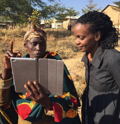 Catherine Nakalembe showing NASA Earth science data collection techniques to a Village Knowledge Agent in Iringa, Tanzania, June 2016.
