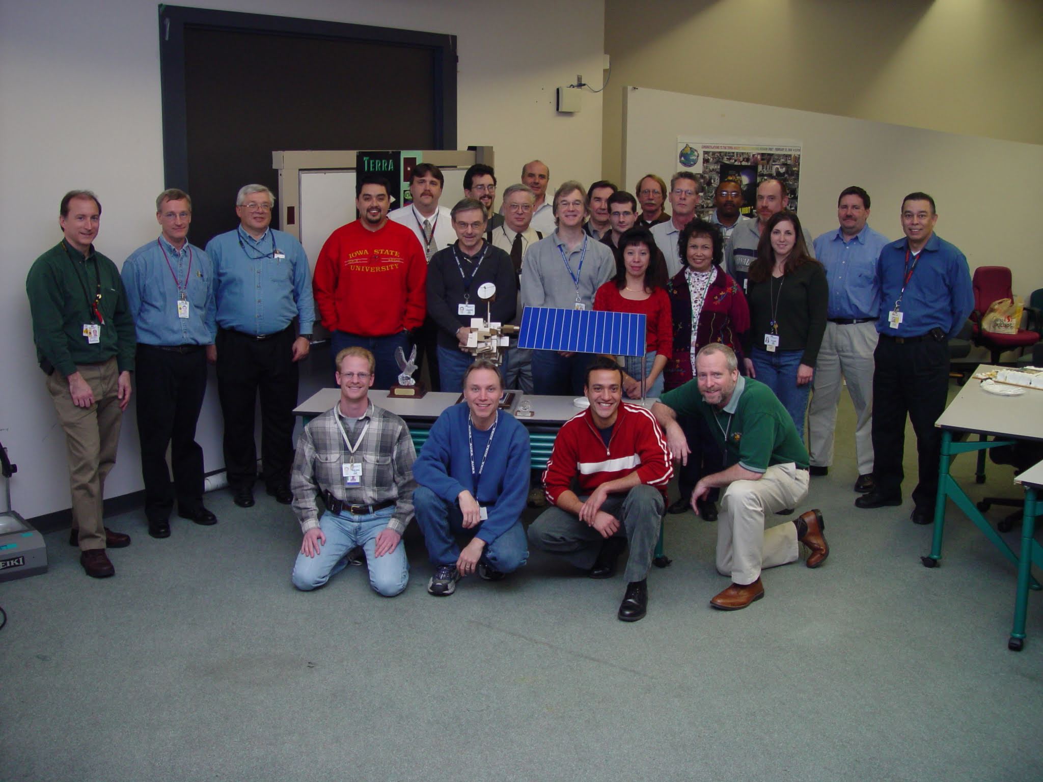 Celebrating the 10th anniversary of Terra in 2009, the flight operations leads and managers posed around a model of the satellite.