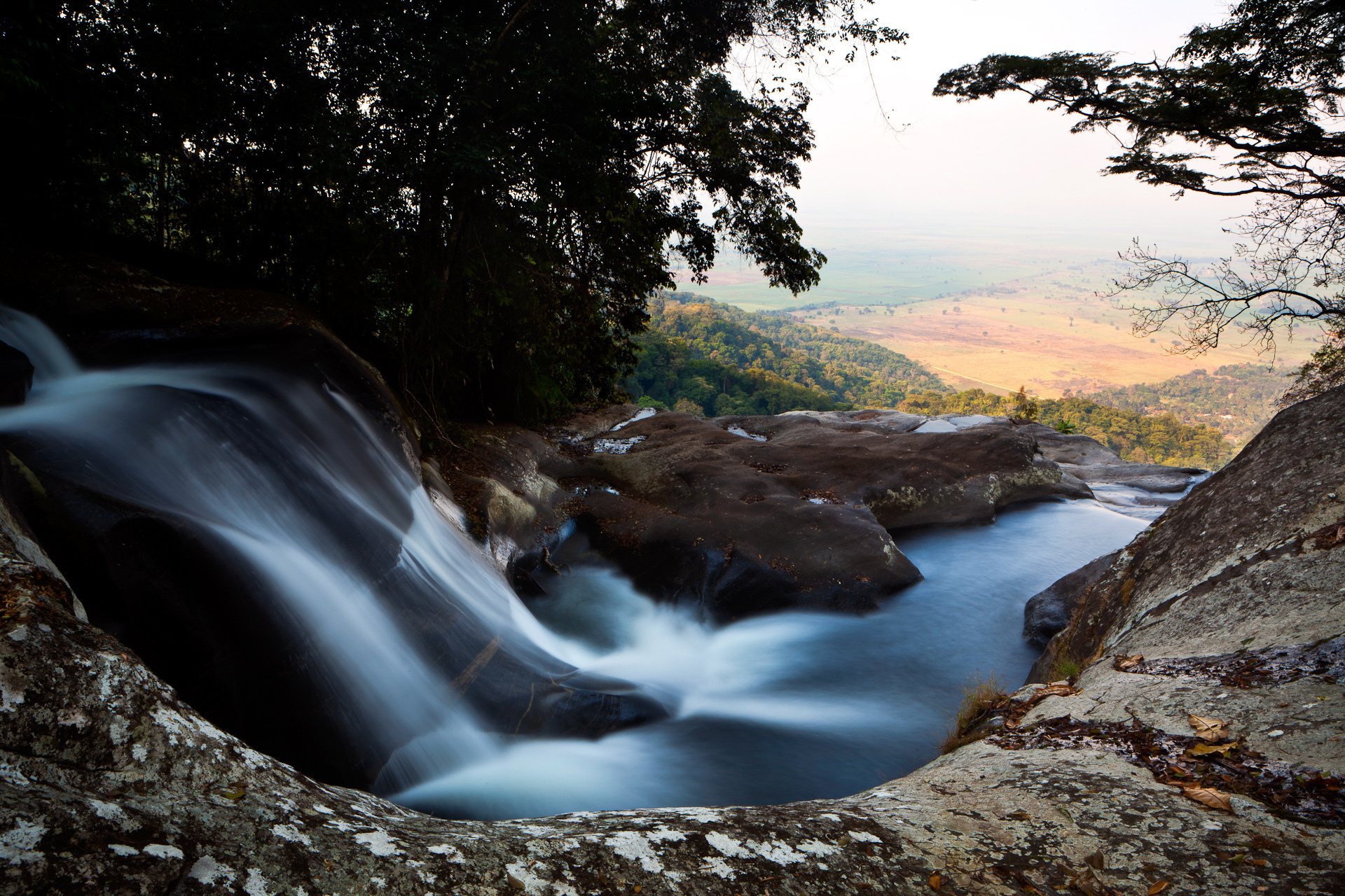 Sanje Waterfall in Udzungwa National Park, Tanzania, overlooks farmland that depends on its water.