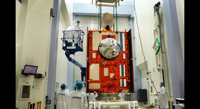 slide 2 - The Sentinel-6 Michael Freilich satellite sits in front of a testing chamber