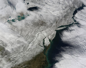 United States: The same pattern with the Arctic Oscillation brought harsh winter conditions to the United States as well. Snow blanketed the East Coast just days before Christmas. Nearly two feet of snow covered the Washington, D.C. area. Image courtesy of NASA, MODIS Rapid Response Team.