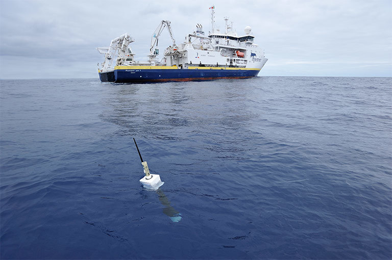 An Argo float, foreground. The new study included direct measurements of ocean temperatures from the global array of 3,500 Argo floats and other ocean sensors. Credit: Argo program, Germany/Ifremer. View larger image.