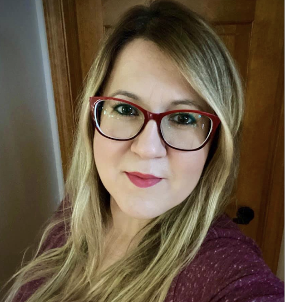 Portrait photo of a woman wearing glasses with long hair