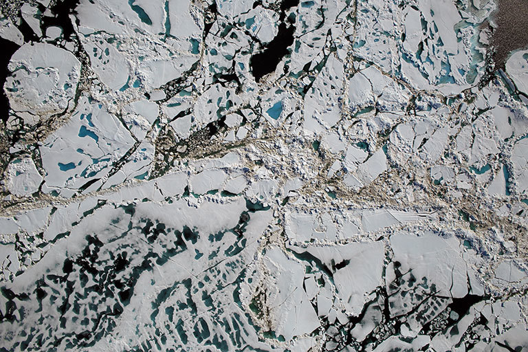 Chunks of sea ice, melt ponds and open water are all seen in this image captured at an altitude of 1,500 feet by the NASA's Digital Mapping System instrument during an Operation IceBridge flight over the Chukchi Sea on Saturday, July 16, 2016. Credit: NASA/Goddard/Operation IceBridge.