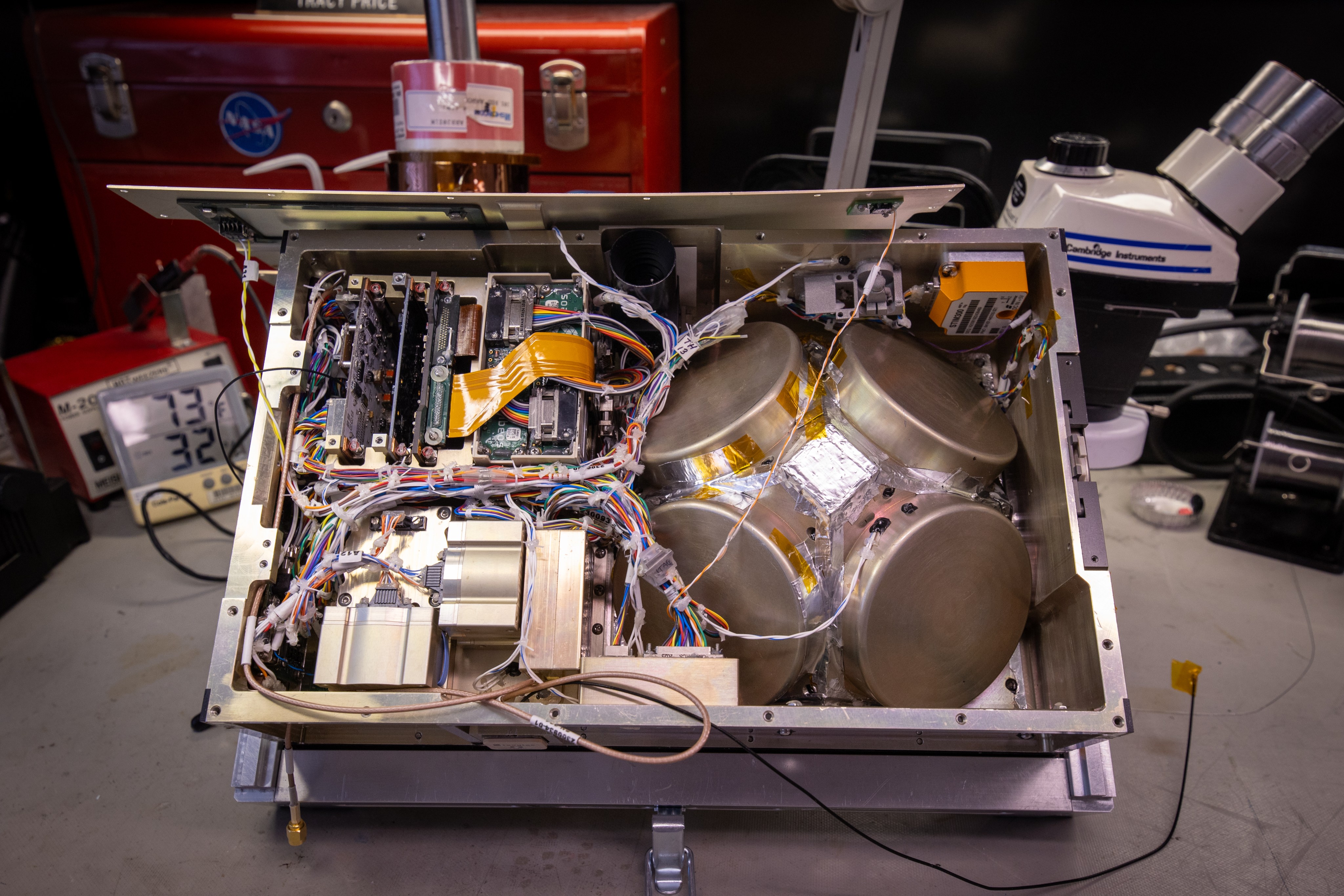 This photograph shows the inside of a small spacecraft.