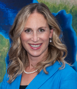 Portrait photo of a smiling woman with blonde hair