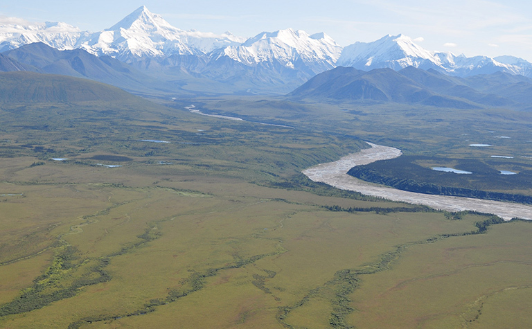 NASA's ABoVE campaign will combine field work, airborne surveys, satellite data and computer modeling to study the effects of climate change on Arctic and boreal ecosystems, such as this region at the base of the Alaska Range south of Fairbanks. Credit: NASA/Ross Nelson. View larger image.