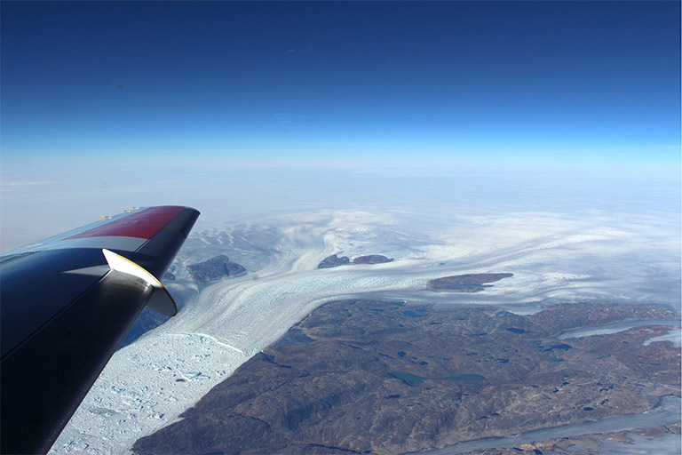 A photo taken over a glacier in Greenland from a NASA plane.
