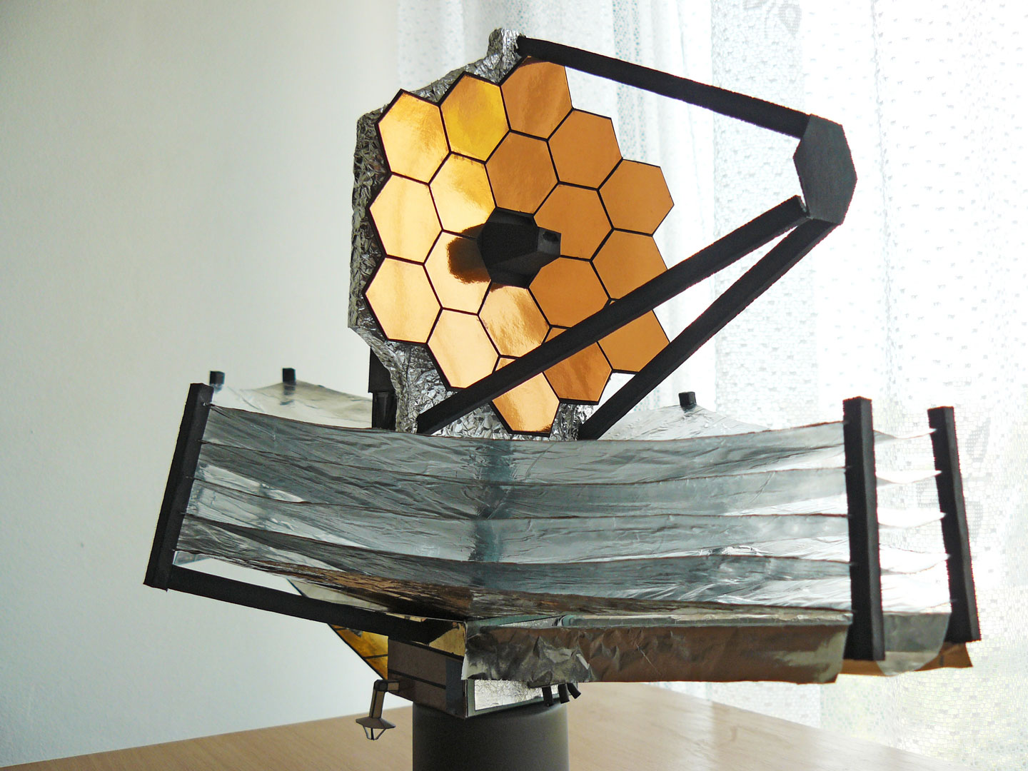 A "Tom Dani modification" of the paper model of the James Webb Space Telescope that also uses layers of aluminum foil and high-gloss self-adhesive foils in addition to the card stock paper used in much of the model.