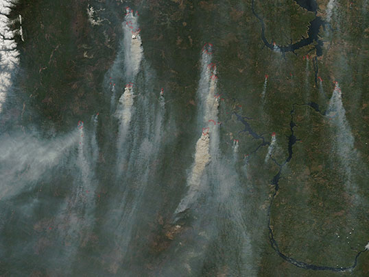 Scientists will use measurements from the Orbiting Carbon Observatory-2 to track atmospheric carbon dioxide to sources such as these wildfires in Siberia, imaged on May 18 by NASA's Moderate Resolution Imaging Spectrometer. Credit: NASA/LANCE/EOSDIS Rapid Response