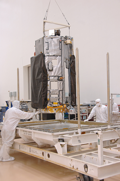 Technicians at Orbital Sciences Corp.'s Satellite Manufacturing Facility in Gilbert, Ariz., prepare NASA's Orbiting Carbon Observatory-2 spacecraft for shipment to its launch site at California's Vandenberg Air Force Base. Credit: Orbital Sciences Corp.