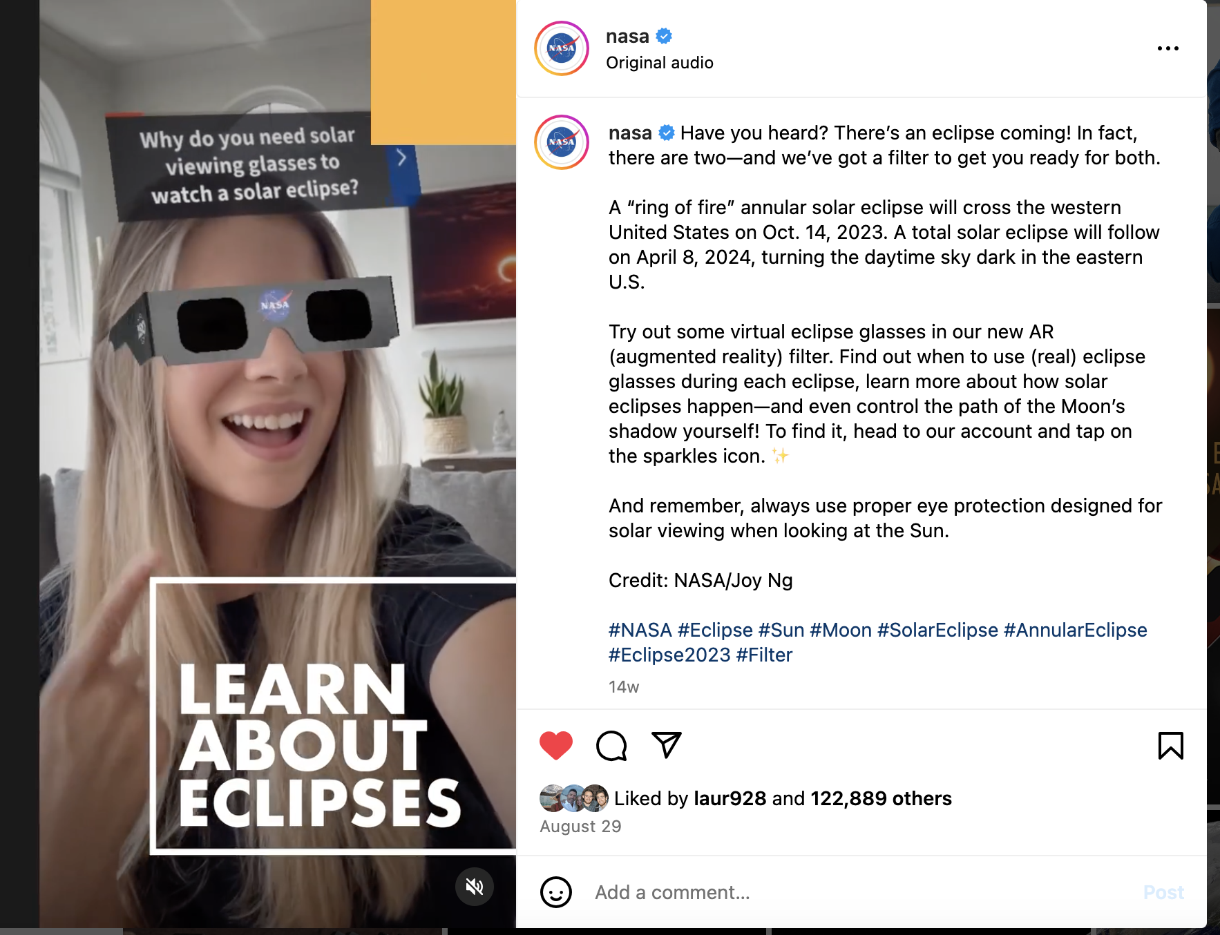 A screenshot of an Instagram reel. A women wears fake eclipse glasses in an augmented reality video.