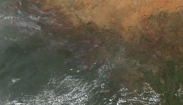 The Moderate Resolution Imaging Spectrometer (MODIS) instrument on NASA's Aqua satellite captured this image of numerous fires burning in the transition zone between the Sahara Desert to the north and the greener savannas to the south. The image, dating from November 2004, includes parts of Sudan, Chad and other nations to the south and west. Credit: NASA. View larger image.