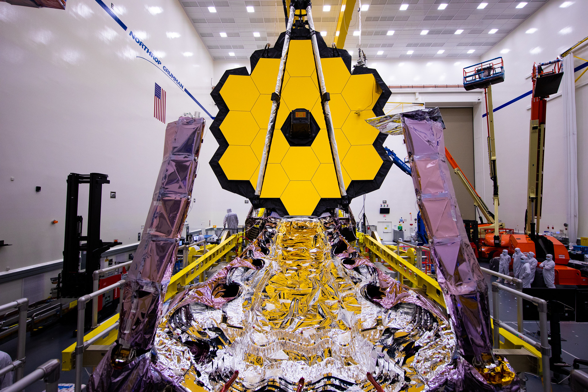 Webb in the Northrup Grumman clean room for final integration and test before launch. Shown here with the primary mirror wings deployed and the sunshield folded within the forward pallet.