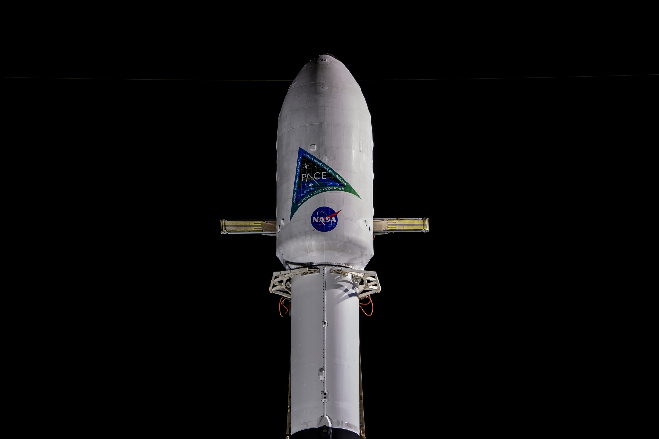 A SpaceX Falcon 9 rocket with NASA's PACE (Plankton, Aerosol, Cloud, ocean Ecosystem) spacecraft encapsulated atop is raised to a vertical position at Space Launch Complex 40 at Cape Canaveral Space Force Station in Florida on Monday, Feb. 5, 2024. PACE is NASA's newest earth-observing satellite that will help increase our understanding of Earth's oceans, atmosphere, and climate by delivering hyperspectral observations of microscopic marine organisms called phytoplankton as well new data on clouds and aerosols. Liftoff of the PACE mission is set for no earlier than 1:33 a.m. EST on Tuesday, Feb. 6, 2024.