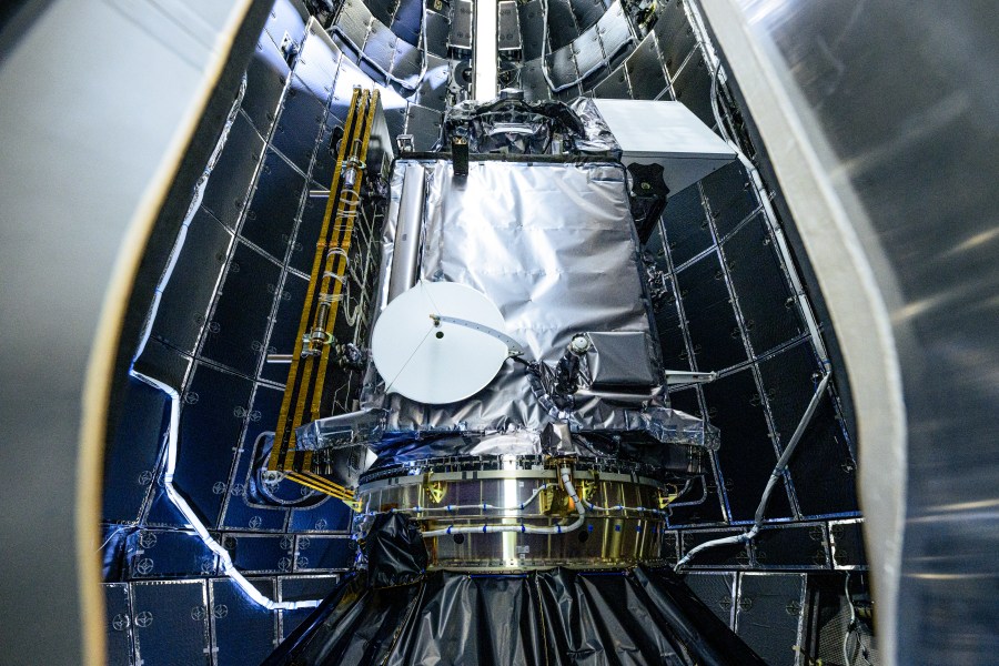 Photo of PACE encapsulation inside (Plankton, Aerosol, Cloud, ocean Ecosystem) spacecraft in SpaceX's Falcon 9 payload fairings.