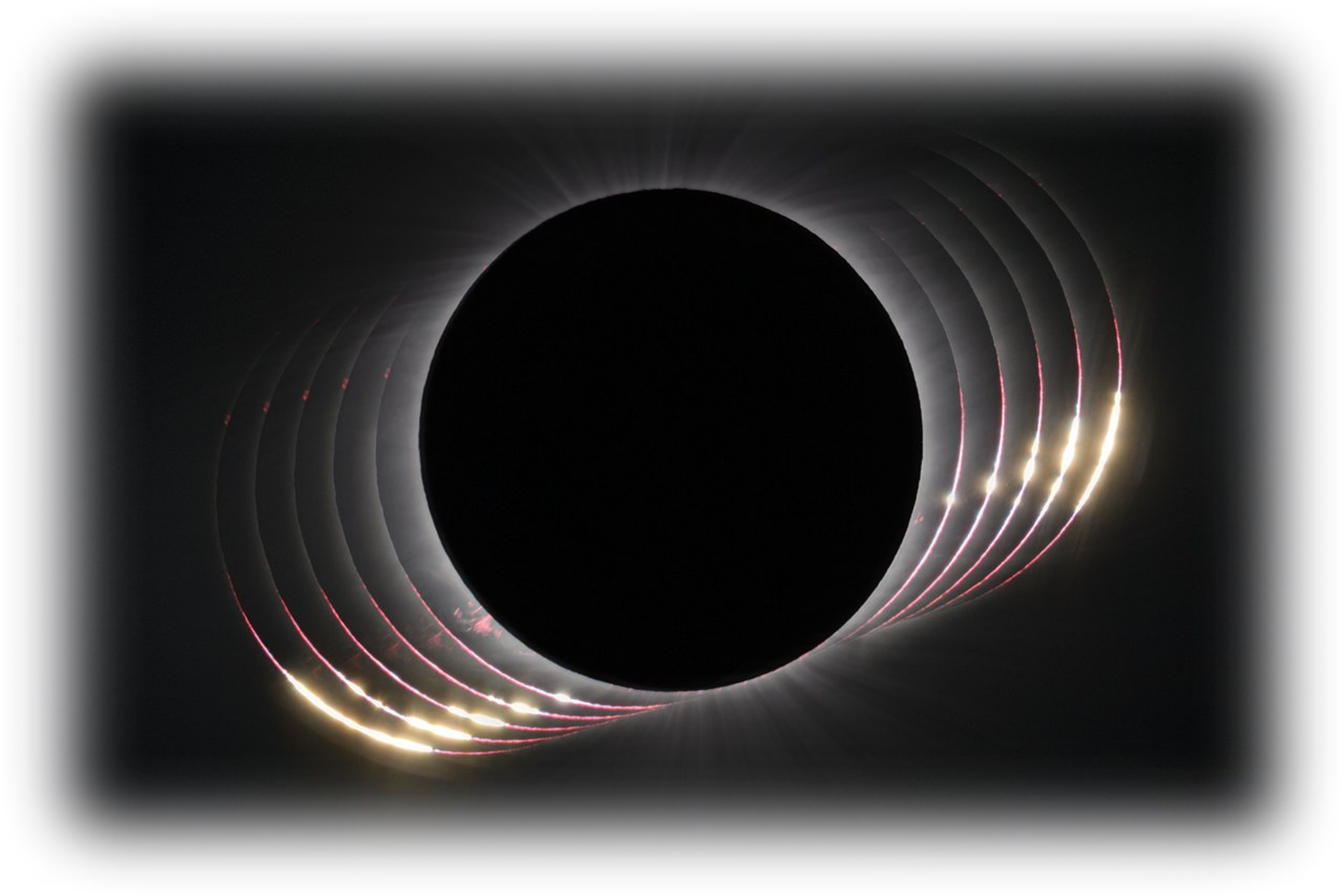 A dark circle in the center with color slivers of light show the movement of the sun during the eclipse.