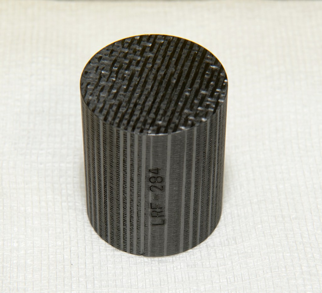 A small dark cylinder.