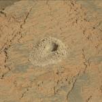 A hole in the surface of Mars created by the Curiosity rover