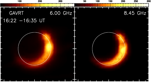 Against a black background, there is an empty black circle. A partial crescent on the bottom right of the circle is seen as bright red, orange, and yellow areas.