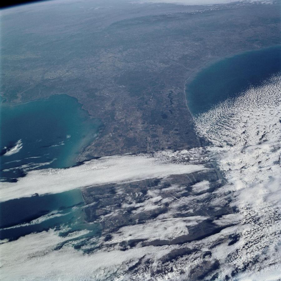The astronauts on board the Space Shuttle Columbia took this 70mm picture featuring part of the eastern sea board. The oblique view looks northward from South Florida to the southern Appalachians. Most of the southeastern United States appears in crisp, clear air in the wake of a cold front that has pushed well off the mainland. Only a few jet stream and low-level clouds remain over South Florida and Gulf Stream. Photo credit: NASA