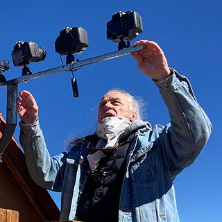Photo of a man holding photo equipment