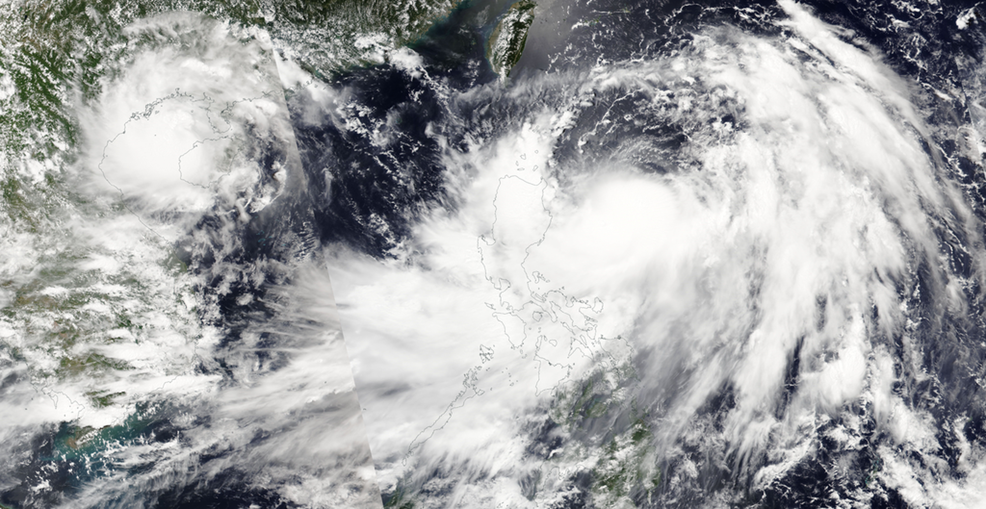 An image of two tropical storms in the Pacific Ocean, as seen from orbit.