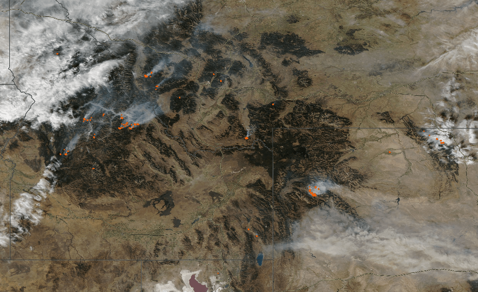 An image from space showing fire in the northern Rocky Mountains as seen from space.