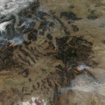 An image from space showing fire in the northern Rocky Mountains as seen from space.