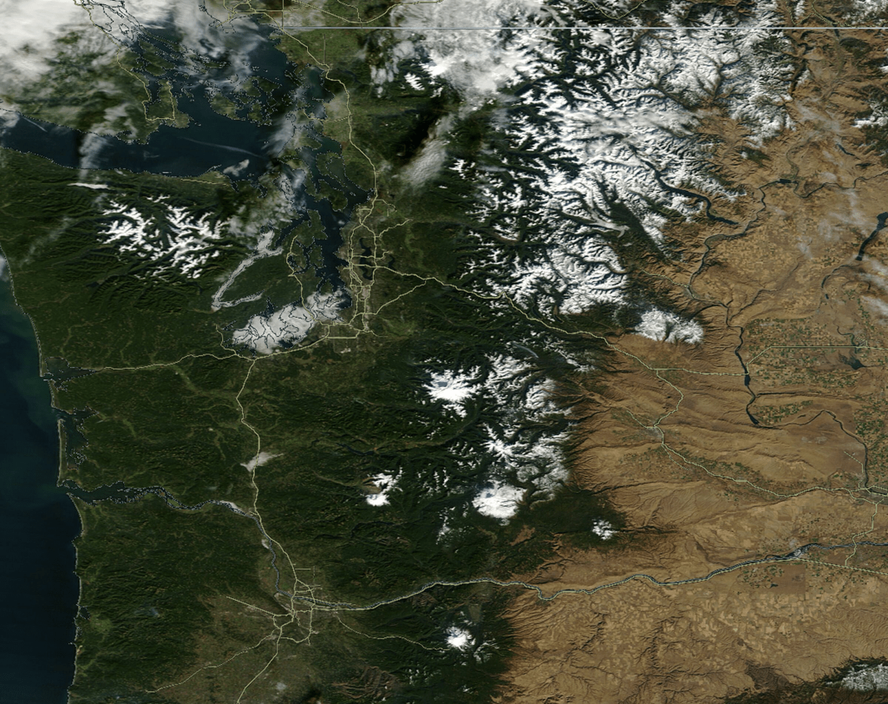 An image from orbit showing new snow in the Pacific Northwest area of the USA.