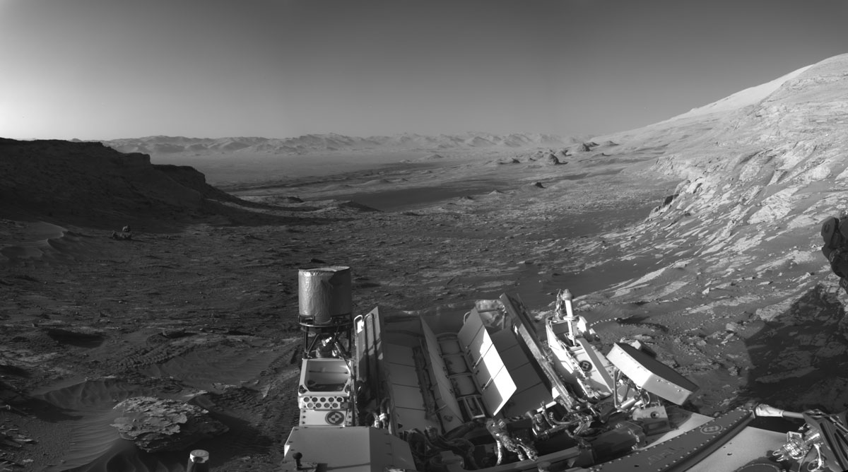 NASA’s Curiosity Mars rover used its black-and-white navigation cameras to capture panoramas of this scene at two times of day. This was the view at 4:10 p.m. local Mars time.