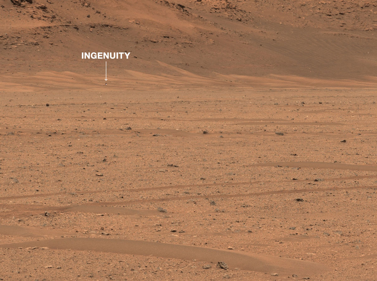 An annotated version of the image pointing out the location of the Mars Helicopter in the distance.