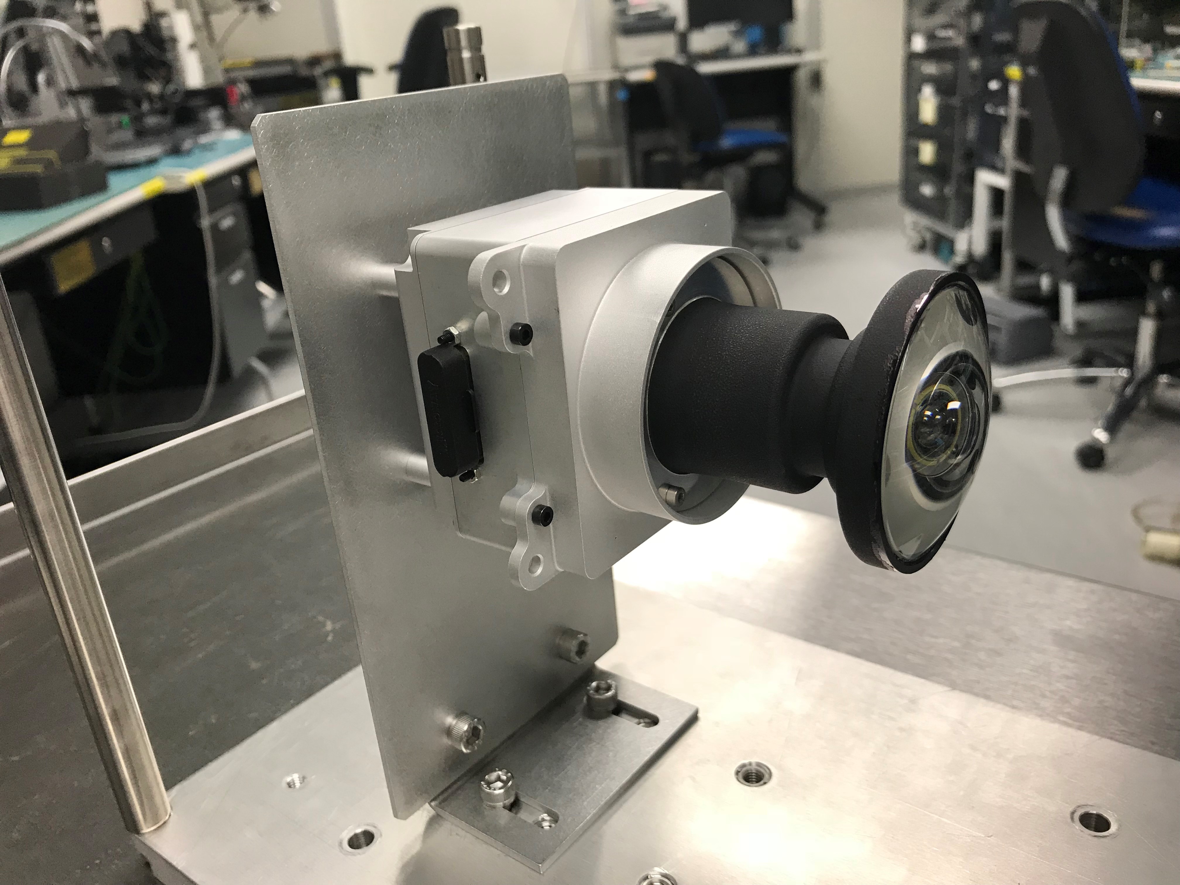 One of the enhanced engineering cameras with a prototype lens for the Hazcams, which will watch for obstacles encountered by the Mars 2020 rover.