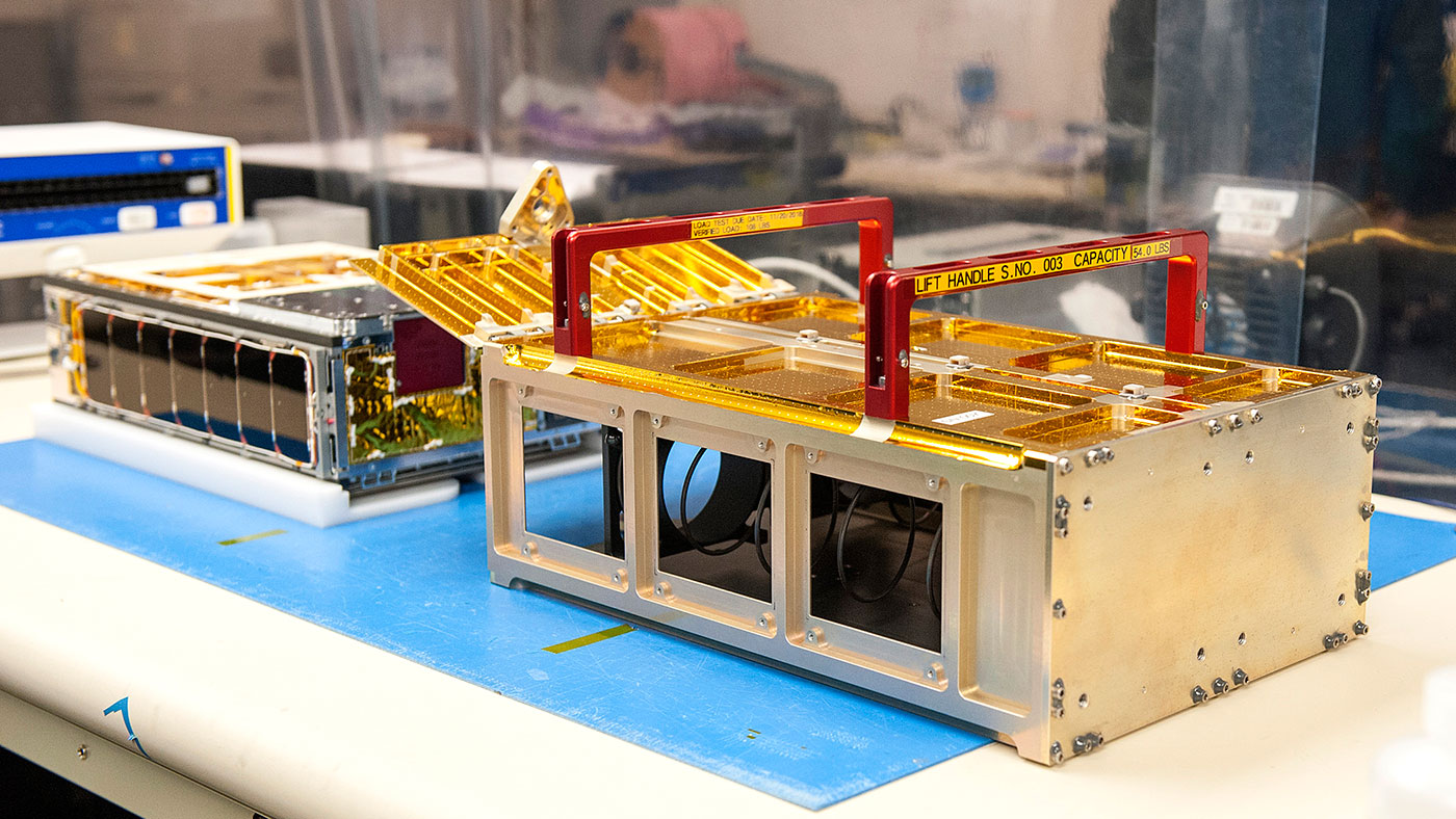 One of the MarCO CubeSats inside a cleanroom at Cal Poly San Luis Obispo, before being placed into its deployment box.