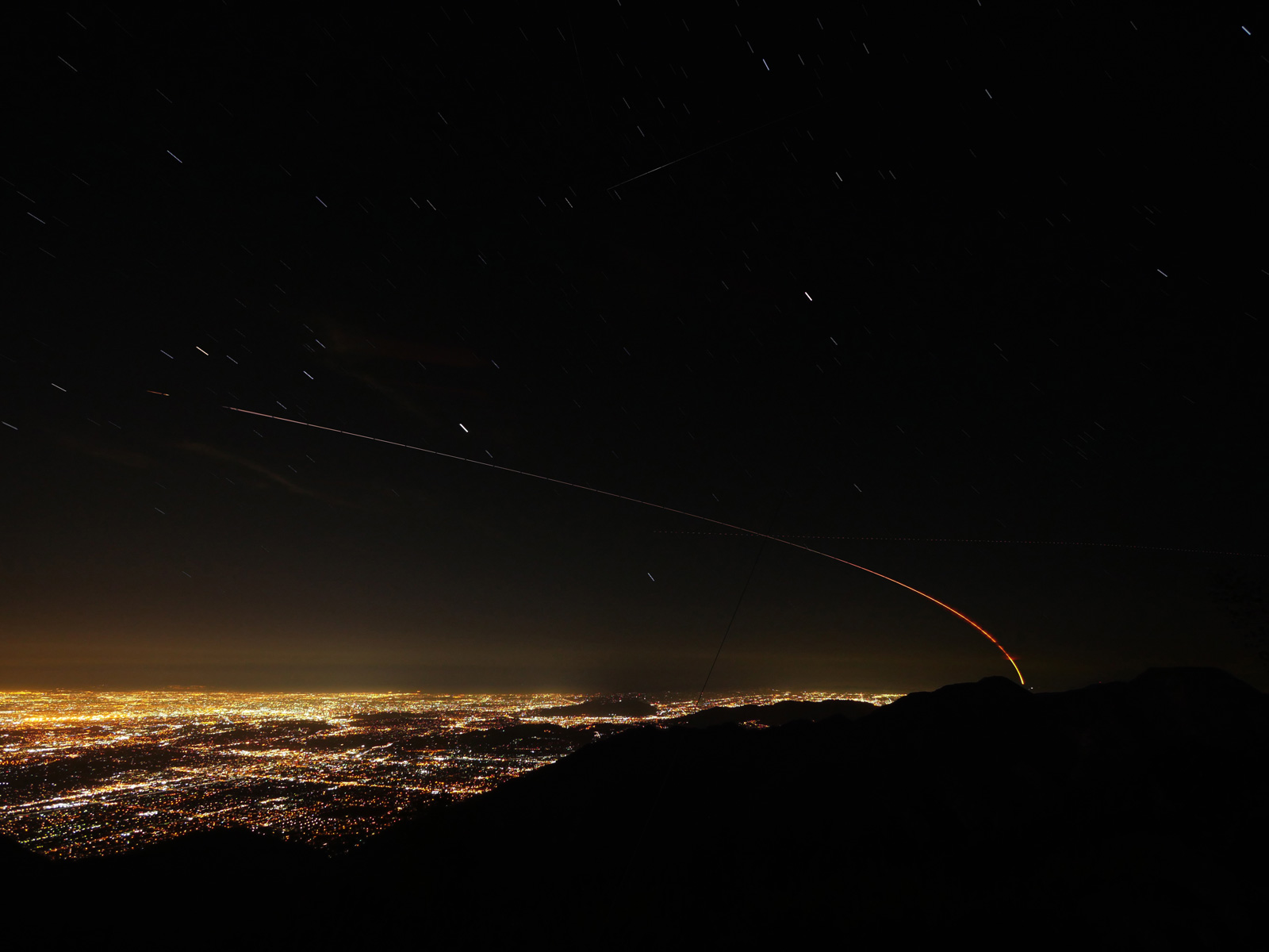 This image shows the trail of NASA’s Mars InSight lander over the Los Angeles area after launching from Vandenberg Air Force Base in Central California on May 5, 2018. This is a stack of exposures taken from Mt. Wilson.