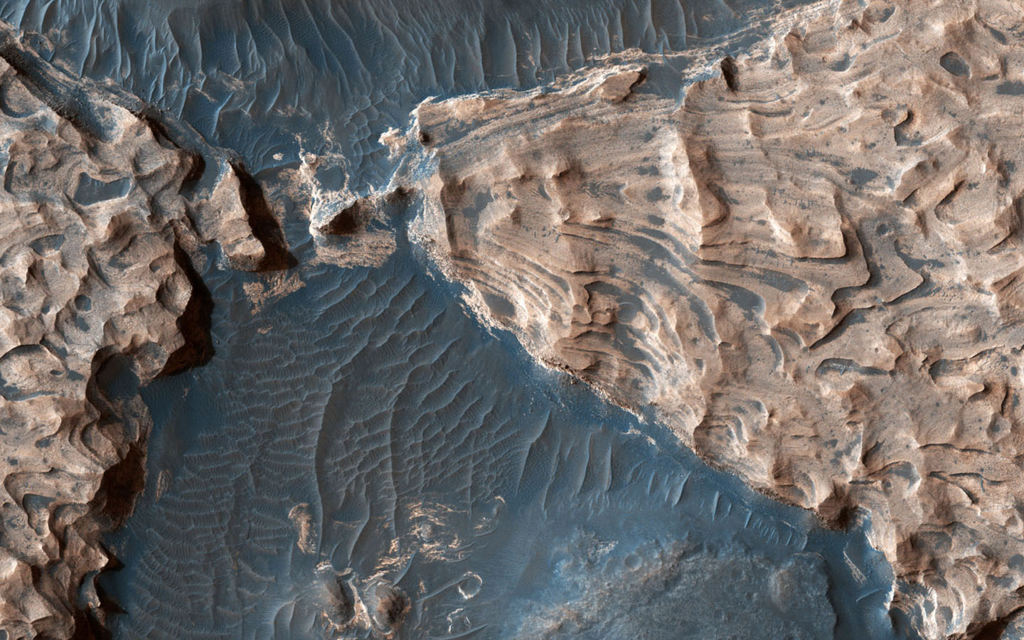 This image from NASA's Mars Reconnaissance Orbiter shows Aram Chaos, a 280-kilometer-wide impact crater in the Southern Highlands. Uplifted blocks of hematite and water-altered silicates indicate that this crater once held a lake.