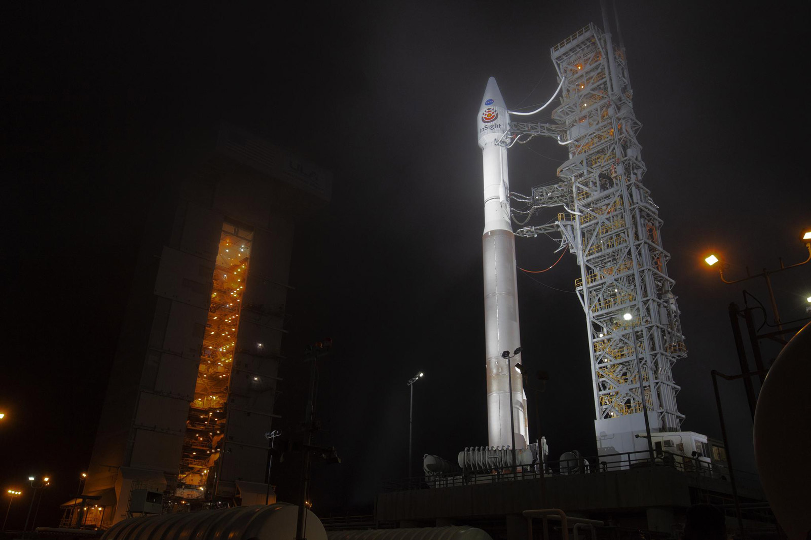 At Vandenberg Air Force Base in California, the gantry rolls back at Space Launch Complex 3 in preparation for the liftoff of NASA's Interior Exploration using Seismic Investigations, Geodesy and Heat Transport, or InSight, Mars lander.