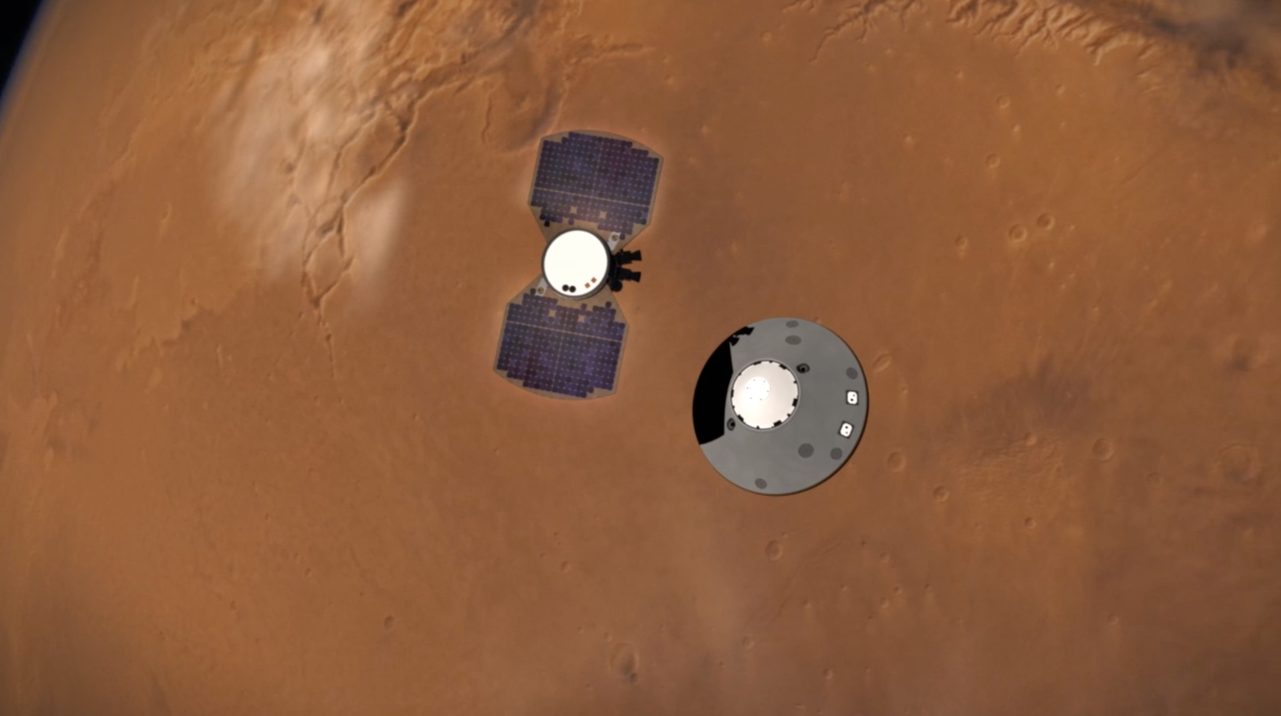 This illustration shows NASA’s InSight lander separating from its cruise stage as it prepares to enter Mars’ atmosphere. The InSight lander is on the right, tucked inside a protective heat shield and back shell. The cruise stage with solar panels is on the left.