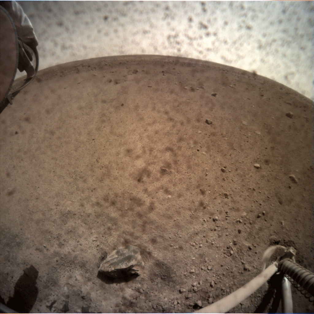 NASA’s InSight spacecraft popped the lens cover off its Instrument Context Camera (ICC) on Nov. 30, 2018, and captured this view of Mars.