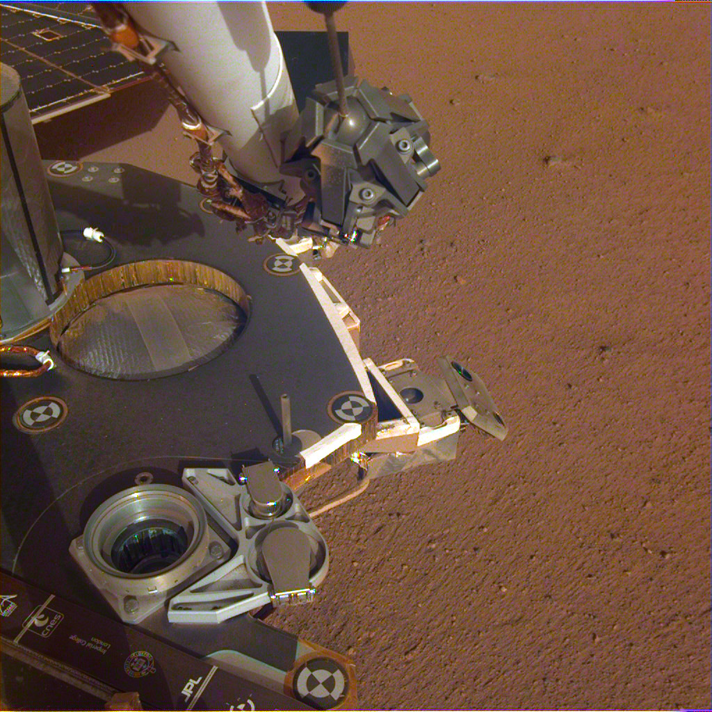 A partial view of the deck of NASA's InSight lander, where it stands on the Martian plains Elysium Planitia. The image was received on Dec. 4, 2018 (Sol 8).