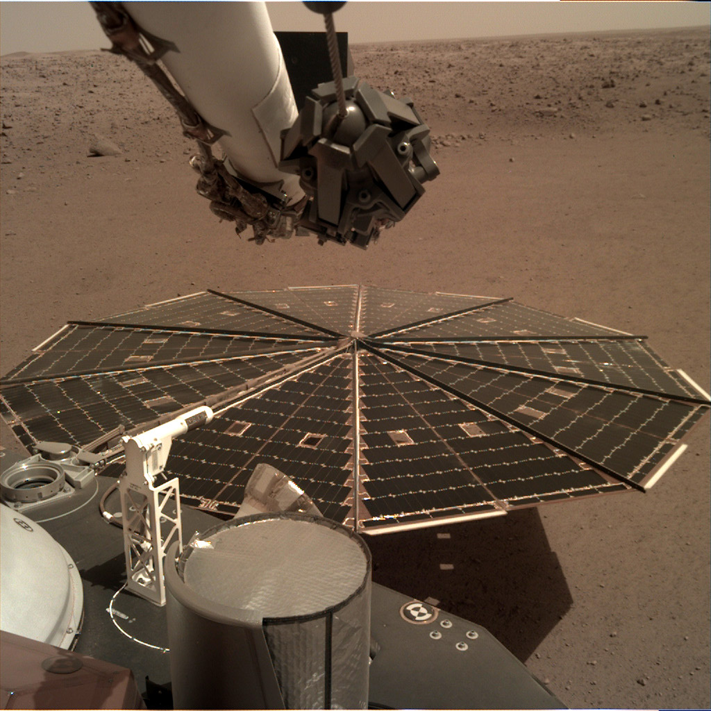 One of InSight's 7-foot (2.2 meter) wide solar panels was imaged by the lander's Instrument Deployment Camera, which is fixed to the elbow of its robotic arm.
