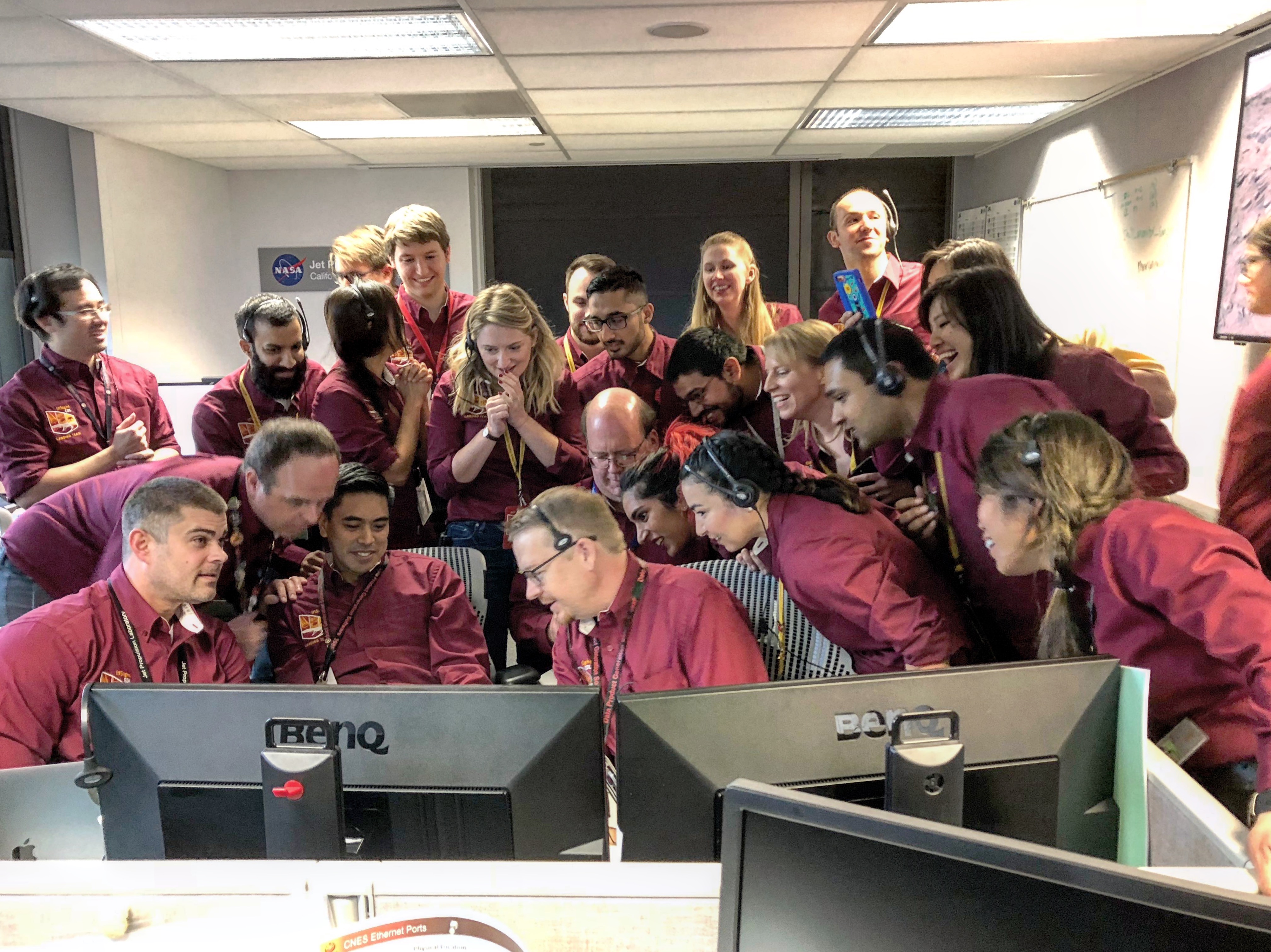 NASA’s InSight mission team in the surface operations area at the Jet Propulsion Laboratory in Pasadena, California, converging on computer screens to get a glimpse of the first picture of Mars on Nov. 26, 2018.