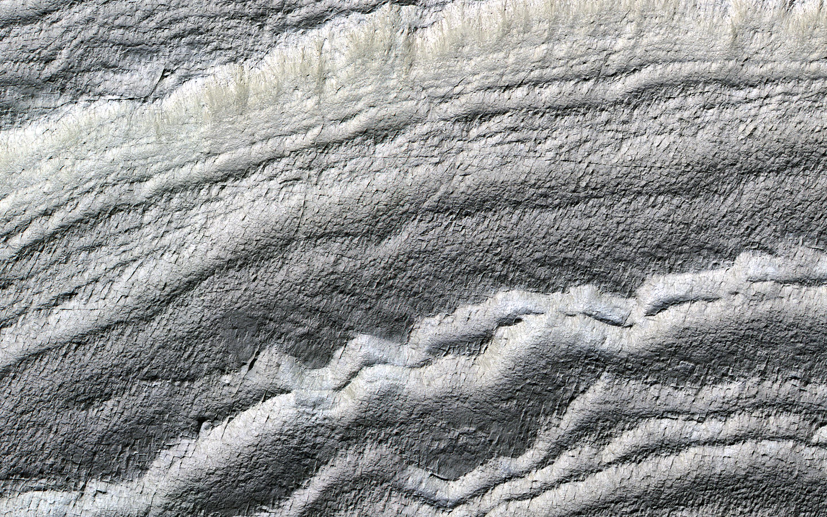 This image acquired on January 21, 2019 by NASAs Mars Reconnaissance Orbiter, shows the south polar layered deposits are well illuminated to accentuate the topography.