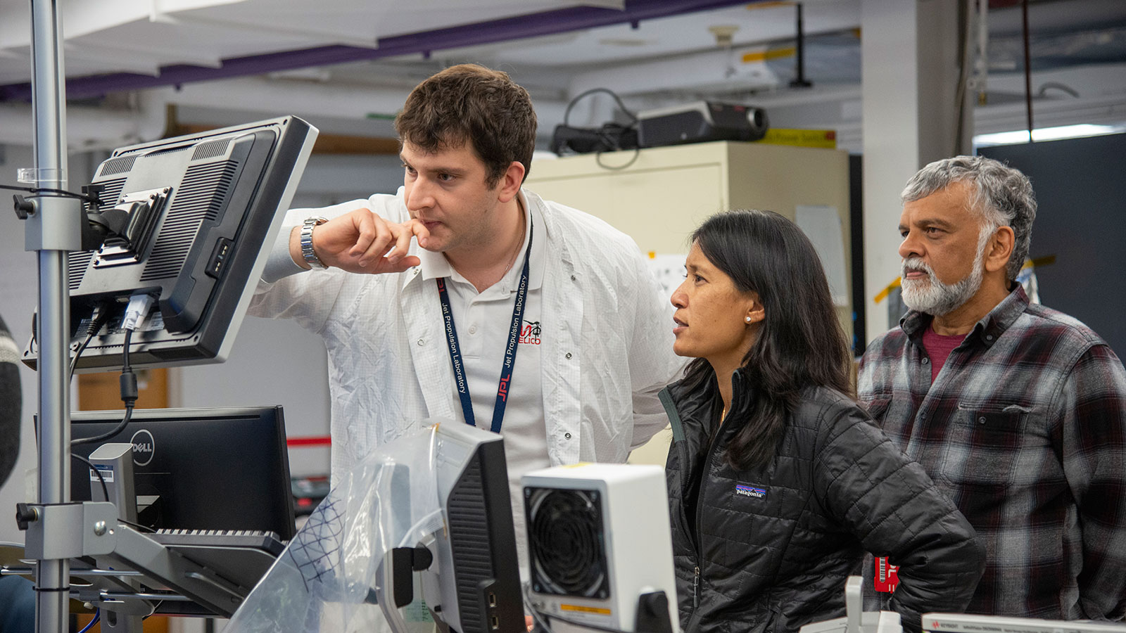 Teddy Tzanetos, MiMi Aung and Bob Balaram of NASA’s Mars Helicopter project observe a flight test.