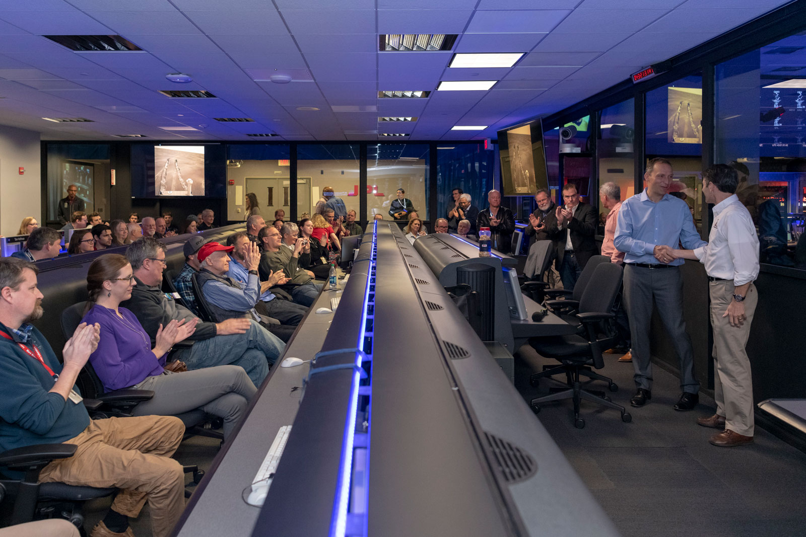 Scientists and engineers who worked on NASA’s Opportunity rover give mission leadership a round of applause in Mission Control at NASA’s Jet Propulsion Laboratory in Pasadena, California.