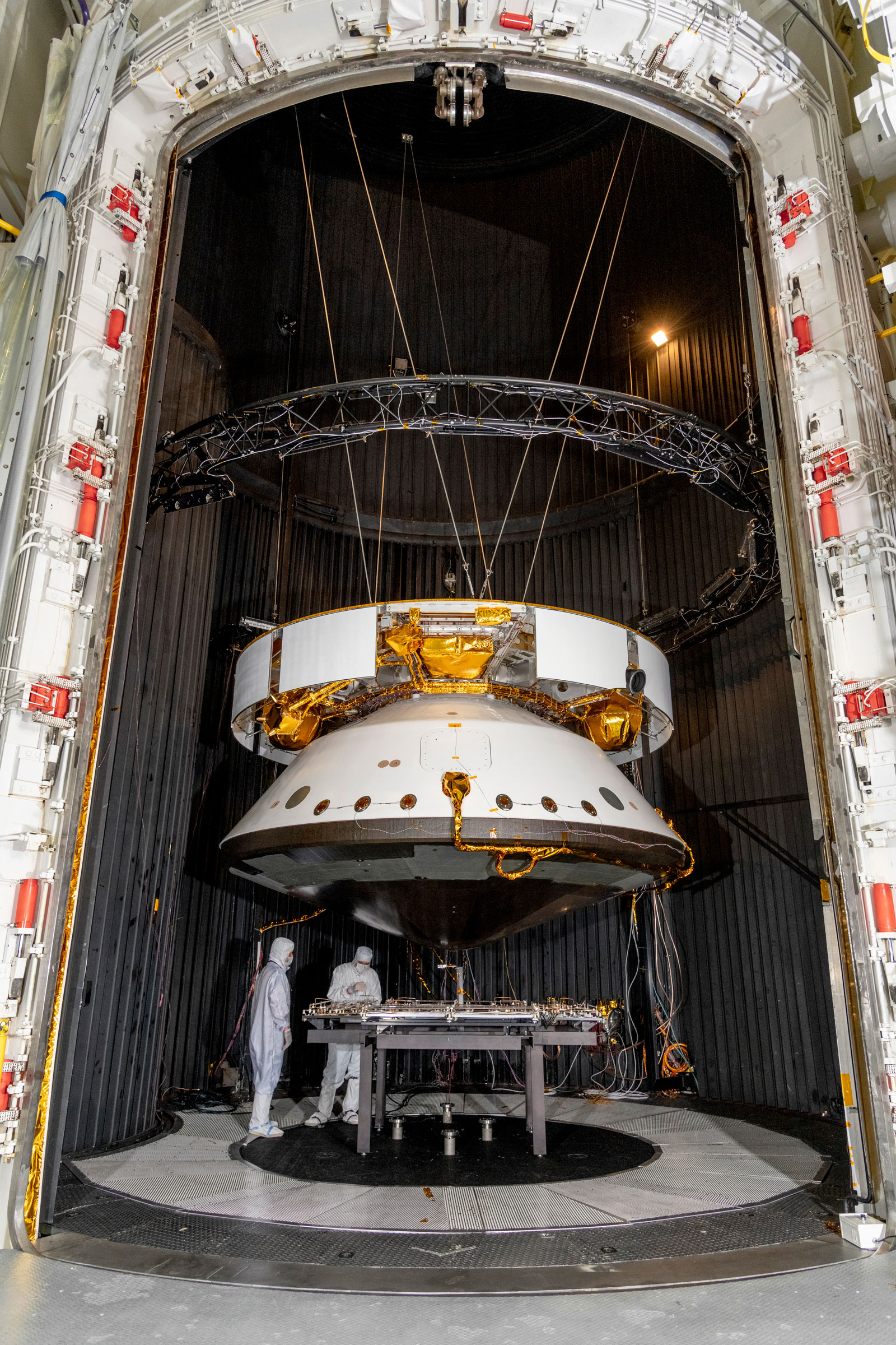 Engineers prepare the Mars 2020 spacecraft for a thermal vacuum (TVAC) test in the Space Simulator Facility at NASA's Jet Propulsion Laboratory in Pasadena, California.