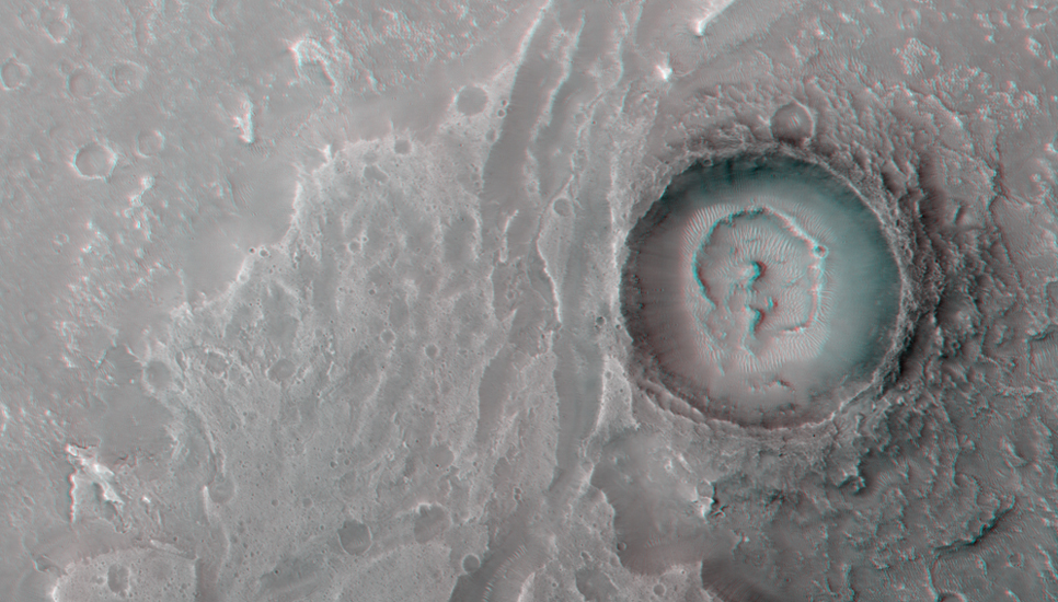 This image show a fan-shaped deposit where a channel enters a crater.