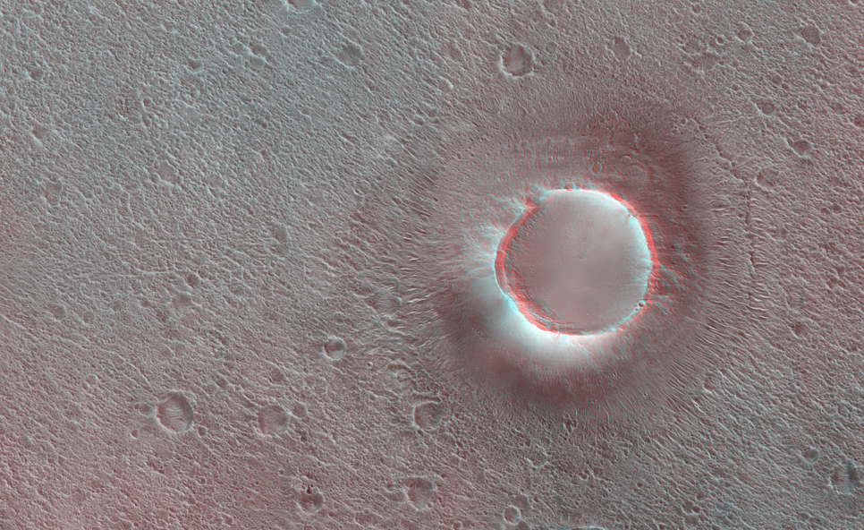 This HiRISE image shows a group of cones, shield-like features, and round mounds.