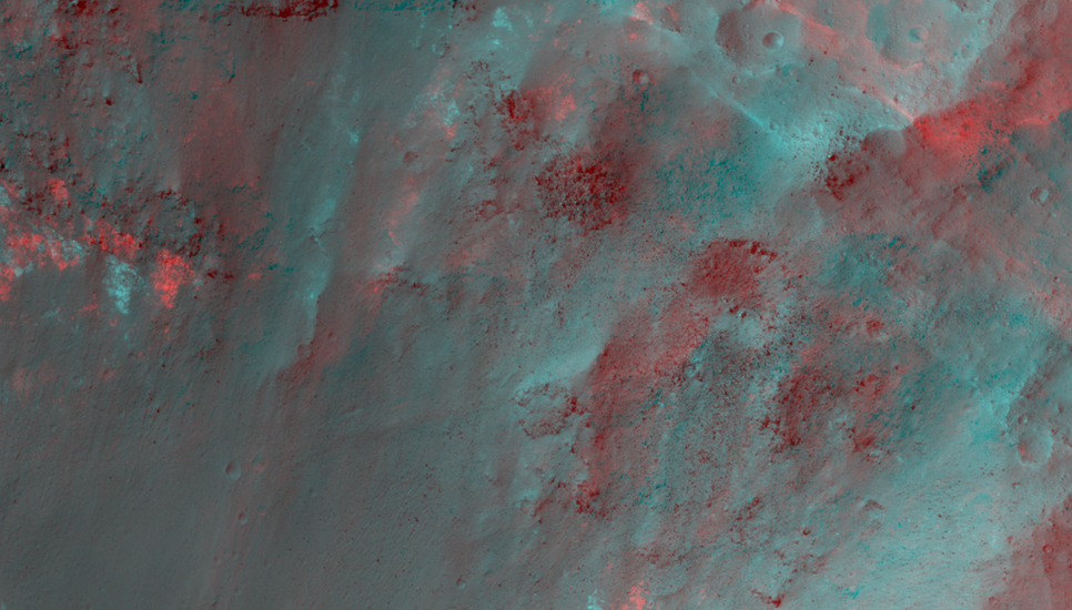 The colorful rocks exposed in the central peak visible in this image probably reflect variations in mineral content that were caused by water activity early in Mars' history.